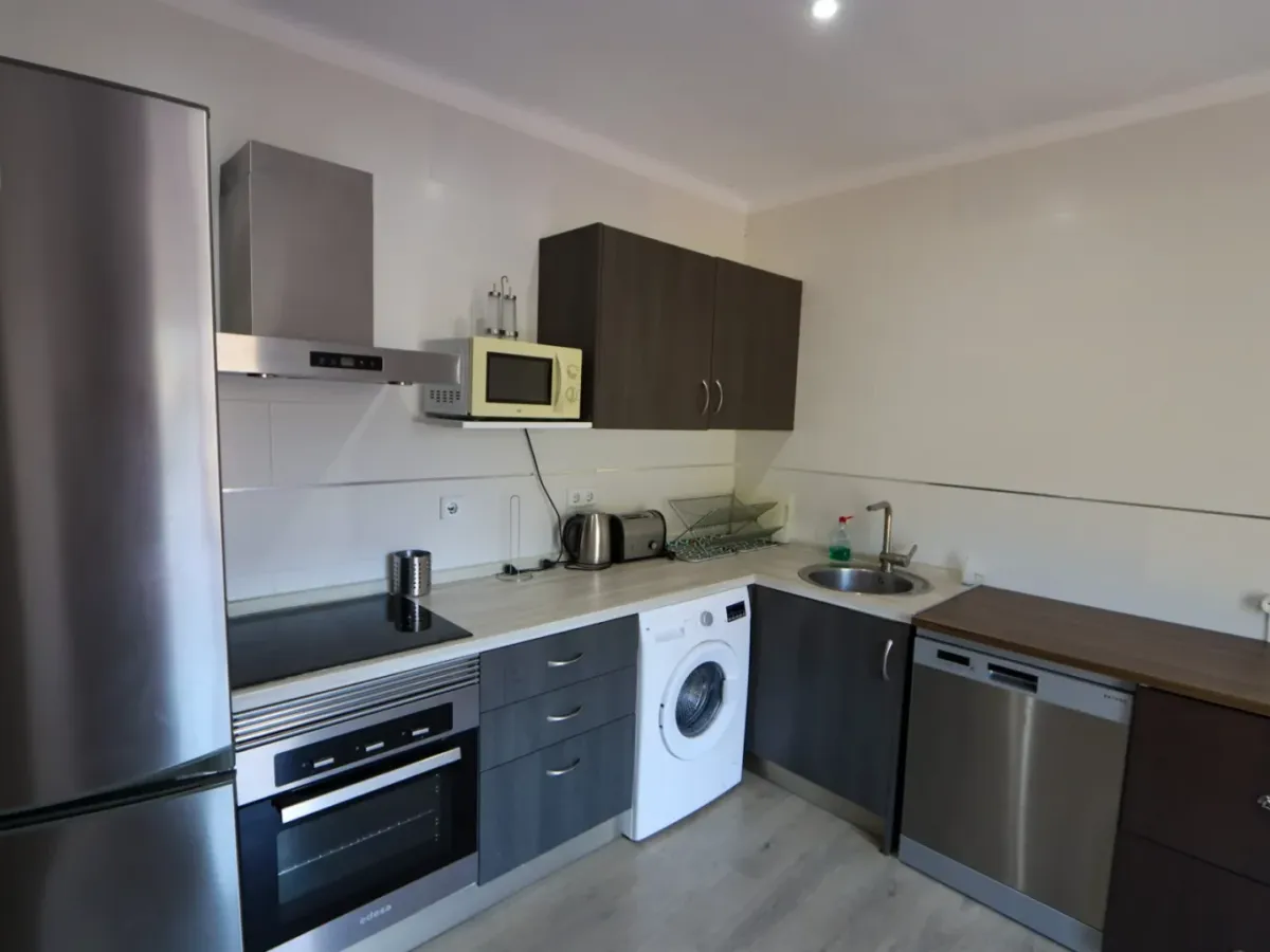 A two-apartment house on a quiet street, featuring a private pool