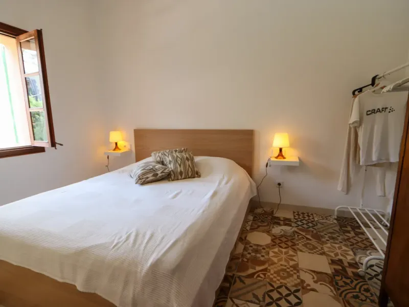 A two-apartment house on a quiet street, featuring a private pool