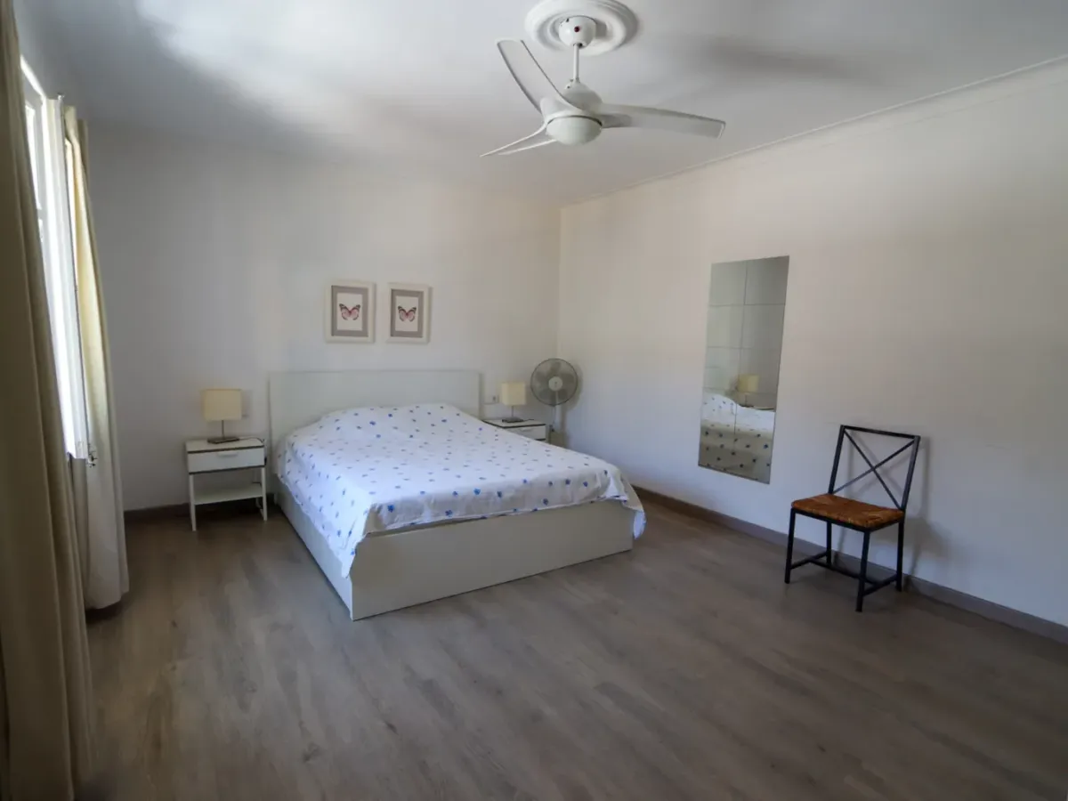 A two-apartment house on a quiet street, featuring a private pool